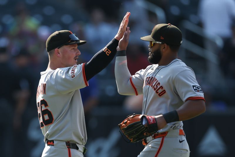 Aug 3, 2025; New York City, New York, USA; San Francisco Giants third baseman Matt Chapman (26) celebrates with left fielder Heliot Ramos (17) after defeating the New York Mets at Citi Field. Mandatory Credit: Vincent Carchietta-Imagn Images