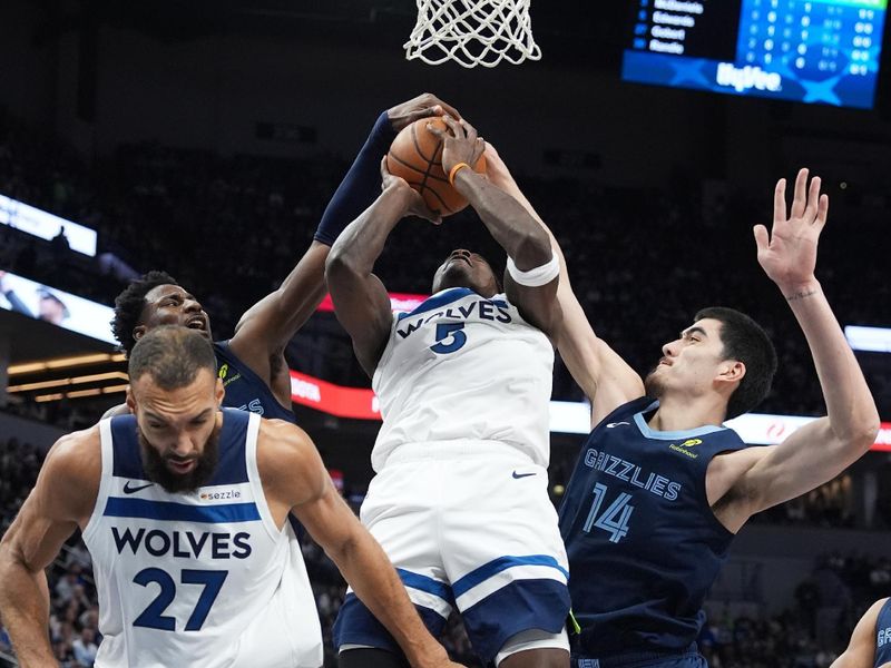 MINNEAPOLIS, MN -  JANUARY 11: Zach Edey #14 of the Memphis Grizzlies blocks the ball during the game against the Minnesota Timberwolves on January 11, 2025 at Target Center in Minneapolis, Minnesota. NOTE TO USER: User expressly acknowledges and agrees that, by downloading and or using this Photograph, user is consenting to the terms and conditions of the Getty Images License Agreement. Mandatory Copyright Notice: Copyright 2025 NBAE (Photo by Jordan Johnson/NBAE via Getty Images)