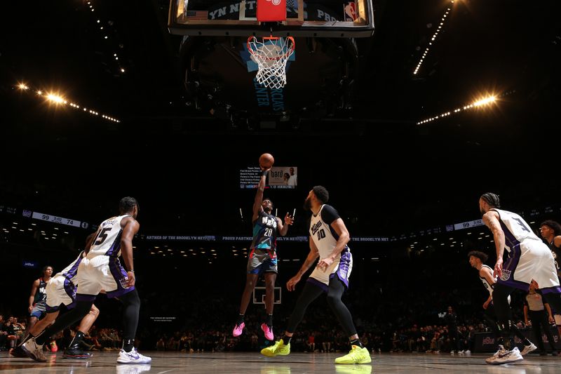 BROOKLYN, NY - APRIL 7: Day'Ron Sharpe #20 of the Brooklyn Nets shoots the ball during the game against the Sacramento Kings on April 7, 2024 at Barclays Center in Brooklyn, New York. NOTE TO USER: User expressly acknowledges and agrees that, by downloading and or using this Photograph, user is consenting to the terms and conditions of the Getty Images License Agreement. Mandatory Copyright Notice: Copyright 2024 NBAE (Photo by Nathaniel S. Butler/NBAE via Getty Images)