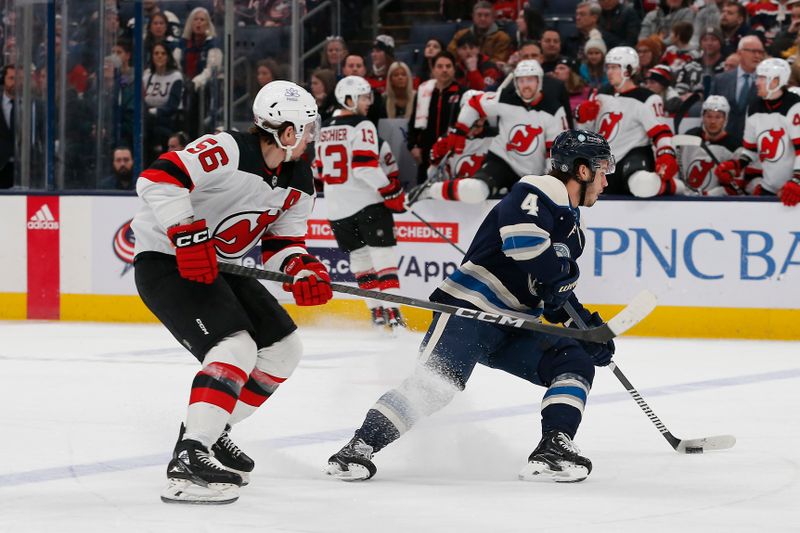 Jan 19, 2024; Columbus, Ohio, USA; Columbus Blue Jackets Forward Cole Sillinger (4) skates with the puck as New Jersey Devils left wing Erik Haula (56) trails the play during the first period at Nationwide Arena. Mandatory Credit: Russell LaBounty-USA TODAY Sports