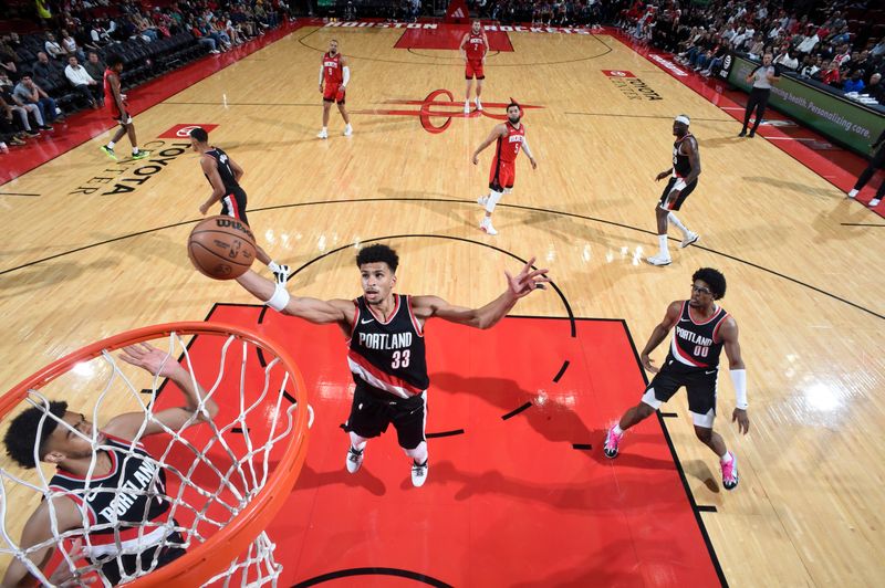 HOUSTON, TX - MARCH 25: Toumani Camara #33 of the Portland Trail Blazers rebounds the ball during the game against the Houston Rockets on March 25, 2024 at the Toyota Center in Houston, Texas. NOTE TO USER: User expressly acknowledges and agrees that, by downloading and or using this photograph, User is consenting to the terms and conditions of the Getty Images License Agreement. Mandatory Copyright Notice: Copyright 2024 NBAE (Photo by Logan Riely/NBAE via Getty Images)