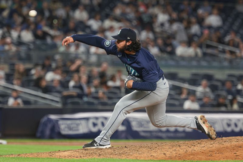 May 21, 2024; Bronx, New York, USA; Seattle Mariners relief pitcher Andres Munoz (75) delivers a pitch during the ninth inning against the New York Yankees at Yankee Stadium. Mandatory Credit: Vincent Carchietta-USA TODAY Sports