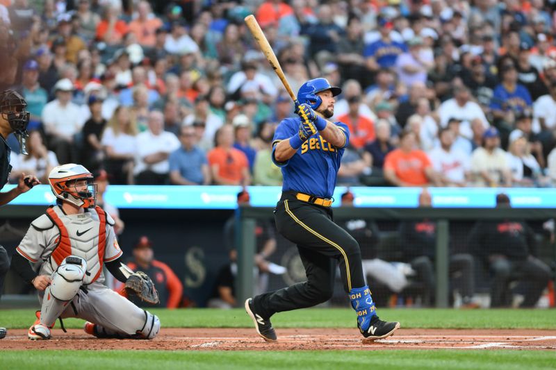 Aug 11, 2023; Seattle, Washington, USA; Seattle Mariners catcher Cal Raleigh (29) hits a 2-run home run against the Baltimore Orioles during the first inning at T-Mobile Park. Mandatory Credit: Steven Bisig-USA TODAY Sports