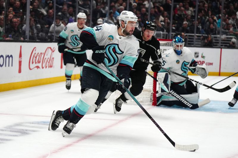 Dec 20, 2023; Los Angeles, California, USA; Seattle Kraken center Devin Shore (94) skaes with the puck against the LA Kings in the third period at Crypto.com Arena. Mandatory Credit: Kirby Lee-USA TODAY Sports