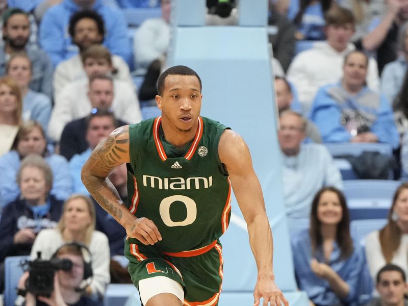 Feb 26, 2024; Chapel Hill, North Carolina, USA; Miami (Fl) Hurricanes guard Matthew Cleveland (0) with the ball in the first half at Dean E. Smith Center. Mandatory Credit: Bob Donnan-USA TODAY Sports