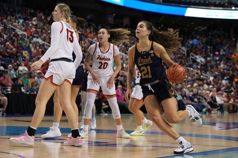 Mar 9, 2024; Greensboro, NC, USA; Notre Dame Fighting Irish forward Maddy Westbeld (21) drives the ball during the second half against the Virginia Tech Hokies at Greensboro Coliseum. Mandatory Credit: David Yeazell-USA TODAY Sports