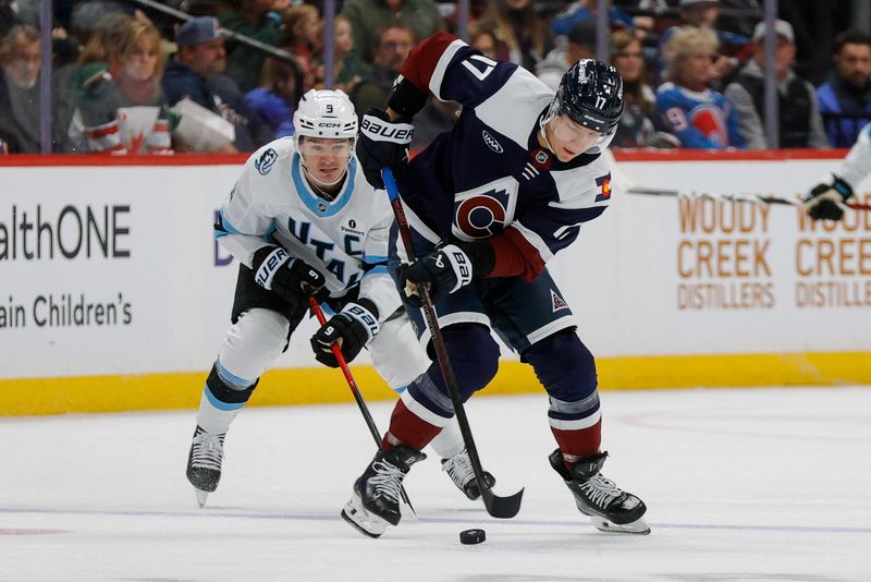 Dec 23, 2025; Denver, Colorado, USA; Colorado Avalanche center Parker Kelly (17) controls the puck ahead of Utah Mammoth right wing Clayton Keller (9) in the second period at Ball Arena. Mandatory Credit: Isaiah J. Downing-Imagn Images