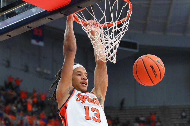 Dec 10, 2022; Syracuse, New York, USA; Syracuse Orange forward Benny Williams (13) dunks the ball against the Georgetown Hoyas during the second half at the JMA Wireless Dome. Mandatory Credit: Rich Barnes-USA TODAY Sports