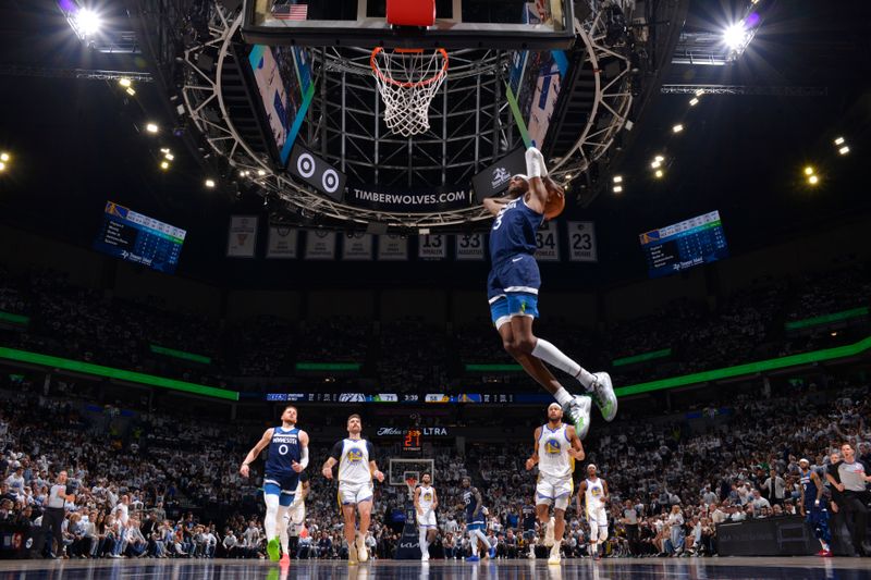 MINNEAPOLIS, MN -  MAY 8: Jaden McDaniels #3 of the Minnesota Timberwolves dunks the ball during the game against the Golden State Warriors during Round 2 Game 2 of the 2025 NBA Playoffs on May 8, 2025 at Target Center in Minneapolis, Minnesota. NOTE TO USER: User expressly acknowledges and agrees that, by downloading and or using this Photograph, user is consenting to the terms and conditions of the Getty Images License Agreement. Mandatory Copyright Notice: Copyright 2025 NBAE (Photo by Jesse D. Garrabrant/NBAE via Getty Images)