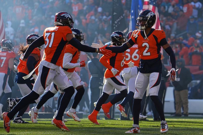 Denver Broncos safety Justin Simmons (31) and Denver Broncos cornerback Pat Surtain II (2) prior to the game against the Cleveland Browns of an NFL football game Sunday November 26, 2023, in Denver. (AP Photo/Bart Young)