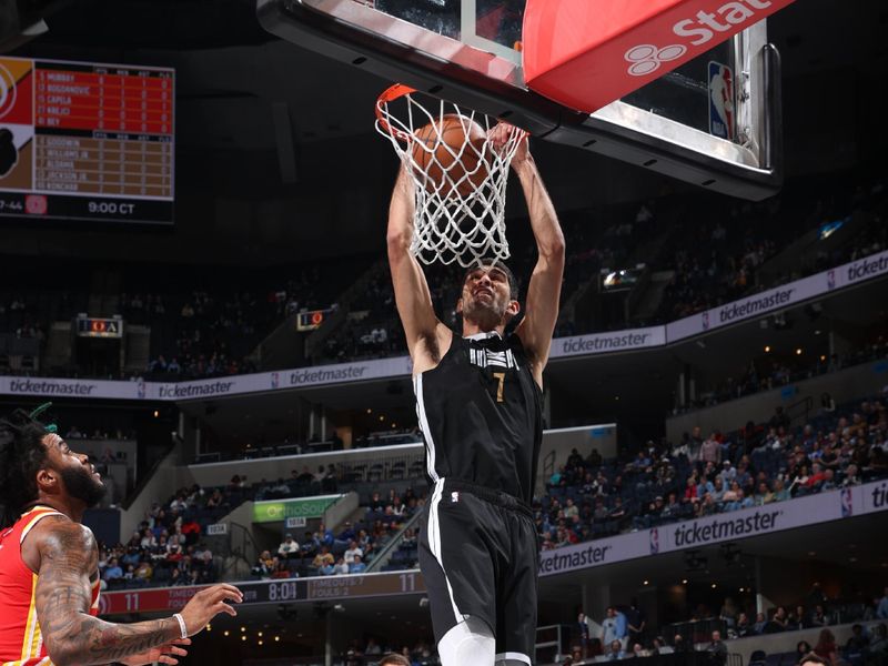 MEMPHIS, TN - MARCH 8: Santi Aldama #7 of the Memphis Grizzlies dunks the ball during the game against the Atlanta Hawks on March 8, 2024 at FedExForum in Memphis, Tennessee. NOTE TO USER: User expressly acknowledges and agrees that, by downloading and or using this photograph, User is consenting to the terms and conditions of the Getty Images License Agreement. Mandatory Copyright Notice: Copyright 2024 NBAE (Photo by Joe Murphy/NBAE via Getty Images)