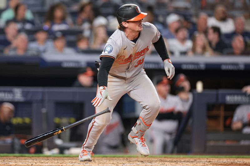 Jun 18, 2024; Bronx, New York, USA; Baltimore Orioles catcher Adley Rutschman (35) singles during the sixth inning against the New York Yankees at Yankee Stadium. Mandatory Credit: Vincent Carchietta-USA TODAY Sports