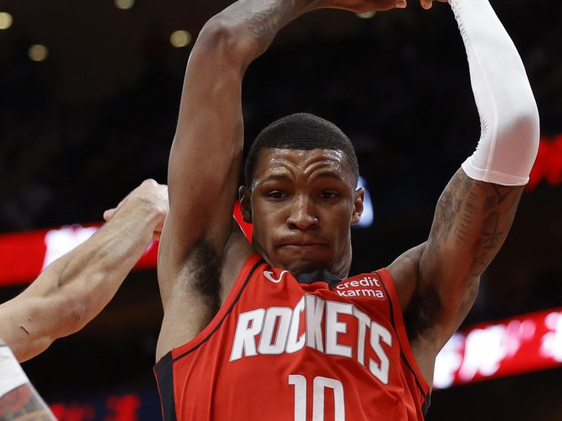 HOUSTON, TEXAS - NOVEMBER 06: Jabari Smith Jr. #10 of the Houston Rockets grabs a rebound against the Sacramento Kings during the first half at Toyota Center on November 06, 2023 in Houston, Texas. (Photo by Carmen Mandato/Getty Images)