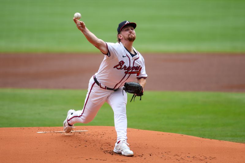 Sep 30, 2024; Atlanta, Georgia, USA; Atlanta Braves starting pitcher Spencer Schwellenbach (56) pitches against the New York Mets in the first inning at Truist Park. Mandatory Credit: Brett Davis-Imagn Images
