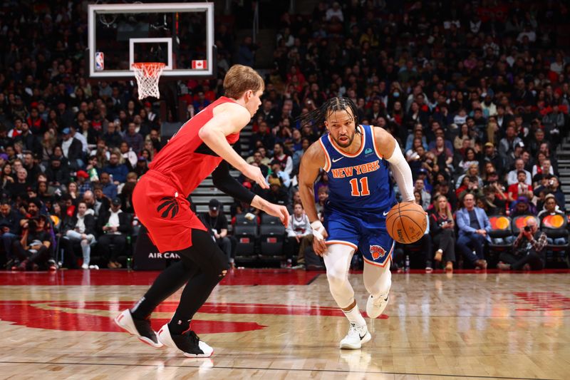 TORONTO, CANADA - MARCH 27: Jalen Brunson #11 of the New York Knicks dribbles the ball during the game against the Toronto Raptors on March 27, 2024 at the Scotiabank Arena in Toronto, Ontario, Canada.  NOTE TO USER: User expressly acknowledges and agrees that, by downloading and or using this Photograph, user is consenting to the terms and conditions of the Getty Images License Agreement.  Mandatory Copyright Notice: Copyright 2024 NBAE (Photo by Vaughn Ridley/NBAE via Getty Images)