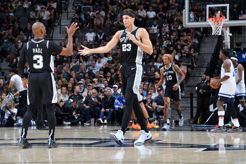 SAN ANTONIO, TX - NOVEMBER 2: Victor Wembanyama #1 Zach Collins #23 of the San Antonio Spurs high five during the game against the Minnesota Timberwolves on November 2, 2024 at the Frost Bank Center in San Antonio, Texas. NOTE TO USER: User expressly acknowledges and agrees that, by downloading and or using this photograph, user is consenting to the terms and conditions of the Getty Images License Agreement. Mandatory Copyright Notice: Copyright 2024 NBAE (Photos by Michael Gonzales/NBAE via Getty Images)