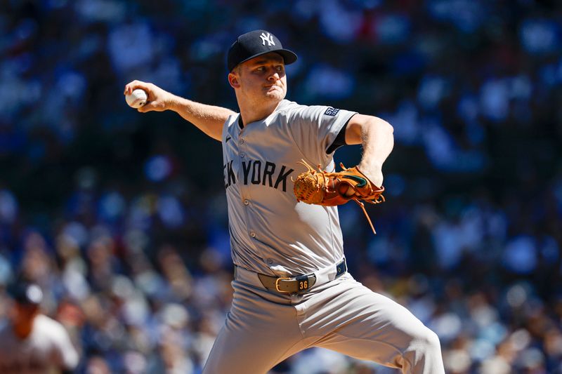 Sep 7, 2024; Chicago, Illinois, USA; New York Yankees starting pitcher Clarke Schmidt (36) delivers a pitch against the Chicago Cubs during the first inning at Wrigley Field. Mandatory Credit: Kamil Krzaczynski-Imagn Images