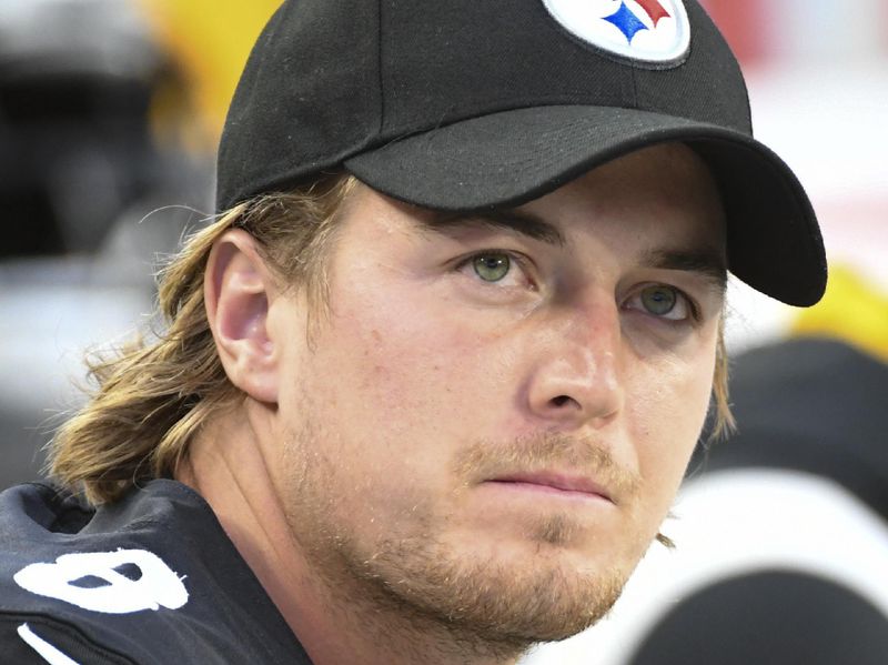 Pittsburgh Steelers quarterback Kenny Pickett (8) sits on the bench between plays against the Seattle Seahawks during the first half of an NFL preseason football game, Saturday, Aug. 13, 2022, in Pittsburgh. (AP Photo/Fred Vuich)