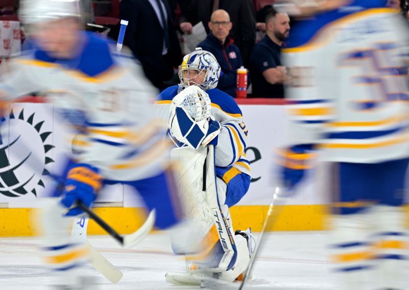 Feb 21, 2024; Montreal, Quebec, CAN; Buffalo Sabres goalie Eric Comrie (31) stretches during the warmup period before the game against the Montreal Canadiens at the Bell Centre. Mandatory Credit: Eric Bolte-USA TODAY Sports