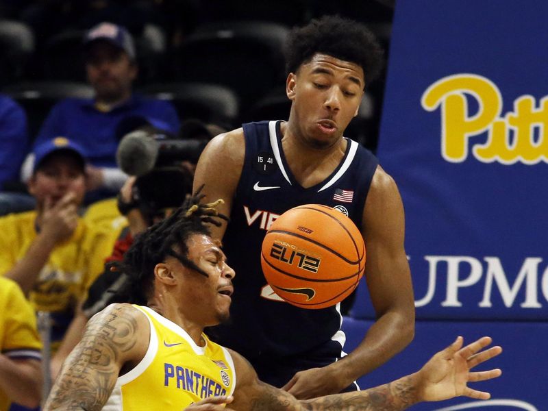 Jan 3, 2023; Pittsburgh, Pennsylvania, USA;  Virginia Cavaliers guard Reece Beekman (top) steals the ball from Pittsburgh Panthers guard Nike Sibande (left) during the first half at the Petersen Events Center. Mandatory Credit: Charles LeClaire-USA TODAY Sports