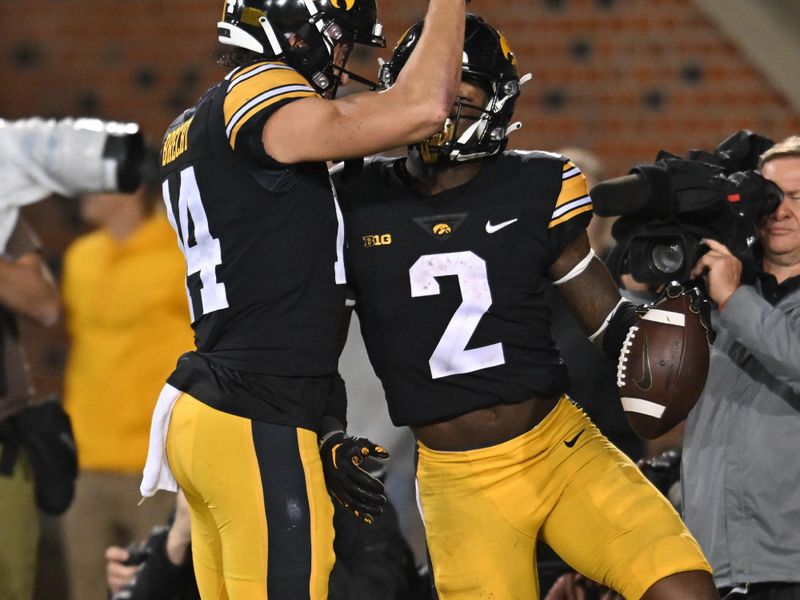 Sep 17, 2022; Iowa City, Iowa, USA; Iowa Hawkeyes running back Kaleb Johnson (2) celebrates with wide receiver Brody Brecht (14) after running for a touchdown against the Nevada Wolf Pack during the fourth quarter at Kinnick Stadium. Mandatory Credit: Jeffrey Becker-USA TODAY Sports