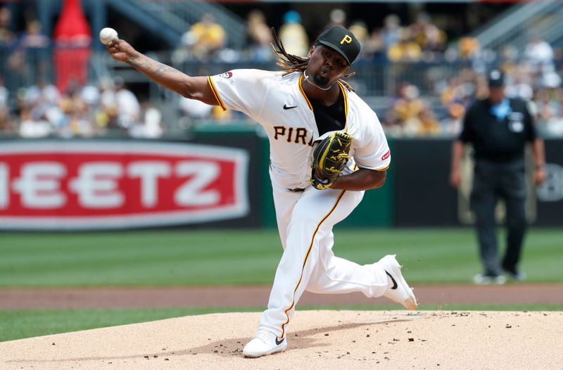 Jul 7, 2024; Pittsburgh, Pennsylvania, USA;  Pittsburgh Pirates starting pitcher Luis L. Ortiz (48) delivers pitch against the New York Mets during the first inning at PNC Park. Mandatory Credit: Charles LeClaire-USA TODAY Sports