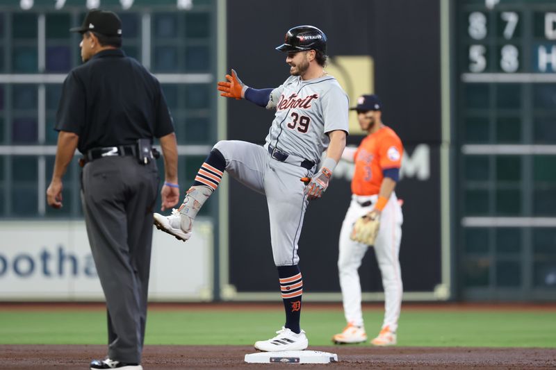 Oct 2, 2024; Houston, Texas, USA; Detroit Tigers shortstop Zach McKinstry (39) reacts after hitting a double against the Houston Astros during the second inning of game two of the Wildcard round for the 2024 MLB Playoffs at Minute Maid Park. Mandatory Credit: Thomas Shea-Imagn Images