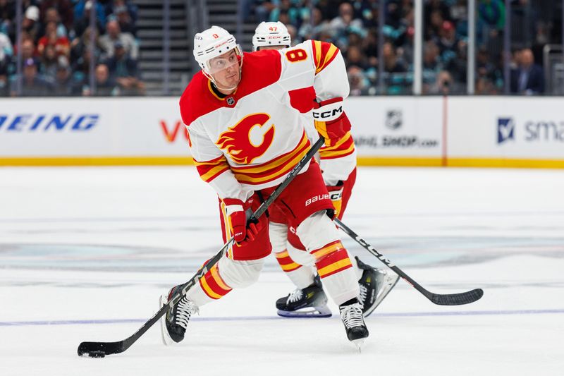 Oct 19, 2024; Seattle, Washington, USA; Calgary Flames defenseman Tyson Barrie (8) shoots against the Seattle Kraken during the second period at Climate Pledge Arena. Mandatory Credit: Caean Couto-Imagn Images
