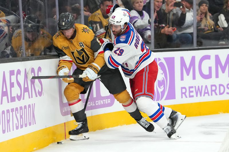 Nov 18, 2025; Las Vegas, Nevada, USA; New York Rangers defenseman Matthew Robertson (29) checks Vegas Golden Knights center Jack Eichel (9) during the first period at T-Mobile Arena. Mandatory Credit: Stephen R. Sylvanie-Imagn Images