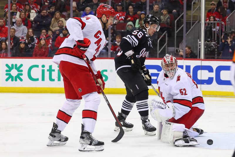 Mar 9, 2024; Newark, New Jersey, USA; Carolina Hurricanes goaltender Pyotr Kochetkov (52) makes a save against the New Jersey Devils during the second period at Prudential Center. Mandatory Credit: Ed Mulholland-USA TODAY Sports