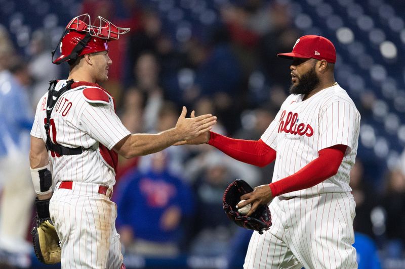 Apr 26, 2023; Philadelphia, Pennsylvania, USA; Philadelphia Phillies relief pitcher Jose Alvarado (46) and catcher J.T. Realmuto (10) celebrate a victory against the Seattle Mariners at Citizens Bank Park. Mandatory Credit: Bill Streicher-USA TODAY Sports