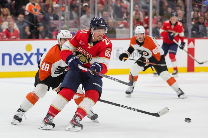 Feb 6, 2024; Sunrise, Florida, USA; Florida Panthers center Nick Cousins (21) moves the puck past Philadelphia Flyers center Morgan Frost (48) during the first period at Amerant Bank Arena. Mandatory Credit: Sam Navarro-USA TODAY Sports