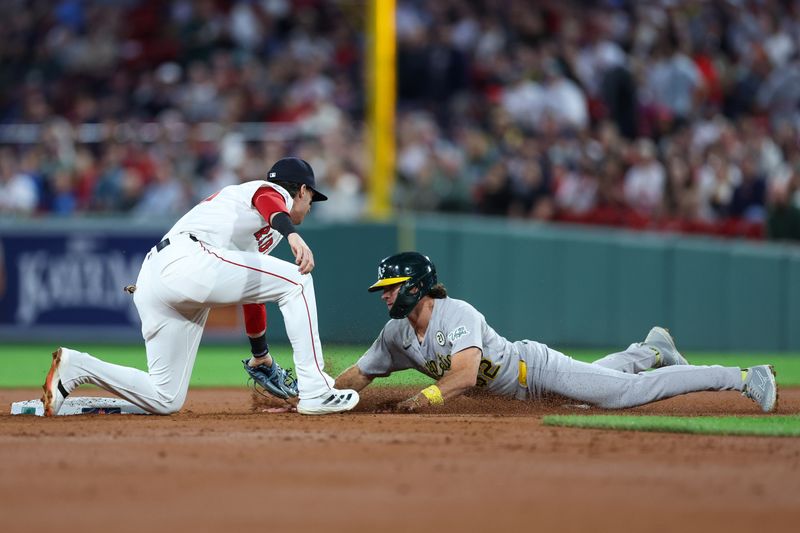 Sep 16, 2025; Boston, Massachusetts, USA; Boston Red Sox second baseman Nick Sogard (20) tags out Athletics right fielder Colby Thomas (32) during the second inning at Fenway Park. Mandatory Credit: Paul Rutherford-Imagn Images