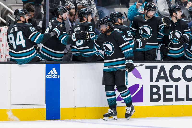 Mar 5, 2024; San Jose, California, USA; San Jose Sharks left wing Anthony Duclair (10) celebrates with teammates after he scored against the Dallas Stars during the first period at SAP Center at San Jose. Mandatory Credit: John Hefti-USA TODAY Sports