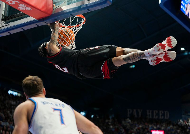 Feb 7, 2026; Lawrence, Kansas, USA; Utah Utes guard Terrence Brown (2) dunks the ball during the first half against the Utah Utes at Allen Fieldhouse. Mandatory Credit: Jay Biggerstaff-Imagn Images