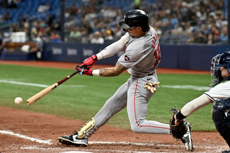 Sep 18, 2024; St. Petersburg, Florida, USA; Boston Red Sox center fielder Jarren Duran (16) hits a RBI single in the eighth inning against the Tampa Bay Rays at Tropicana Field. Mandatory Credit: Jonathan Dyer-Imagn Images