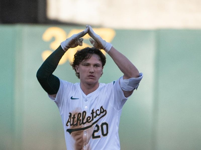 Jun 4, 2024; Oakland, California, USA; Oakland Athletics second base Zack Gelof (20) motions to his teammates after hitting a double against the Seattle Mariners during the third inning at Oakland-Alameda County Coliseum. Mandatory Credit: Ed Szczepanski-USA TODAY Sports