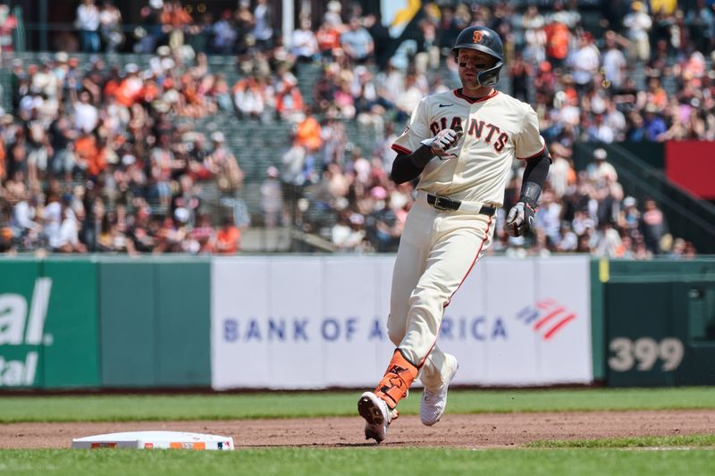 Apr 10, 2024; San Francisco, California, USA; San Francisco Giants shortstop Nick Ahmed (16) runs to third base with a triple against the Washington Nationals during the second inning at Oracle Park. Mandatory Credit: Robert Edwards-USA TODAY Sports