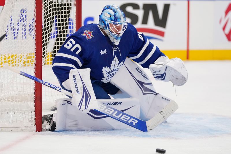 Nov 6, 2023; Toronto, Ontario, CAN; Toronto Maple Leafs goaltender Joseph Woll (60) follows a puck during the second period against the Tampa Bay Lightning at Scotiabank Arena. Mandatory Credit: John E. Sokolowski-USA TODAY Sports