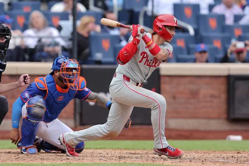 May 14, 2024; New York City, New York, USA; Philadelphia Phillies shortstop Bryson Stott (5) follows through on an RBI single against the New York Mets during the ninth inning at Citi Field. Mandatory Credit: Brad Penner-USA TODAY Sports