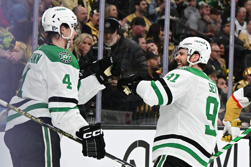 Apr 27, 2024; Las Vegas, Nevada, USA; Dallas Stars defenseman Miro Heiskanen (4) celebrates his second-period goal with center Tyler Seguin (91) against the Vegas Golden Knights in game three of the first round of the 2024 Stanley Cup Playoffs at T-Mobile Arena. Mandatory Credit: Candice Ward-USA TODAY Sports