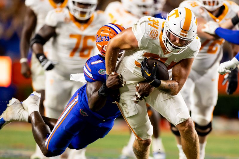 Sep 16, 2023; Gainesville, Florida, USA; Florida Gators defensive end Princely Umanmielen (1) tackles Tennessee Volunteers tight end McCallan Castles (34) during the second half at Ben Hill Griffin Stadium. Mandatory Credit: Matt Pendleton-USA TODAY Sports