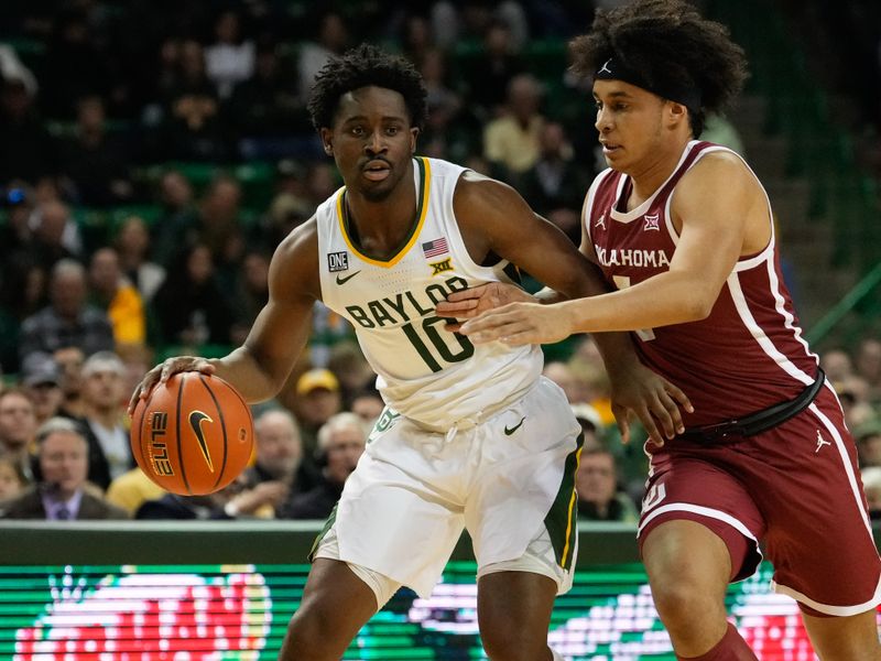 Feb 8, 2023; Waco, Texas, USA;  Baylor Bears guard Adam Flagler (10) controls the ball against Oklahoma Sooners forward Jalen Hill (1) during the first half at Ferrell Center. Mandatory Credit: Chris Jones-USA TODAY Sports