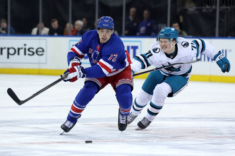 Nov 14, 2024; New York, New York, USA; New York Rangers center Filip Chytil (72) skates with the puck against San Jose Sharks center Macklin Celebrini (71) during the first period at Madison Square Garden. Mandatory Credit: Brad Penner-Imagn Images