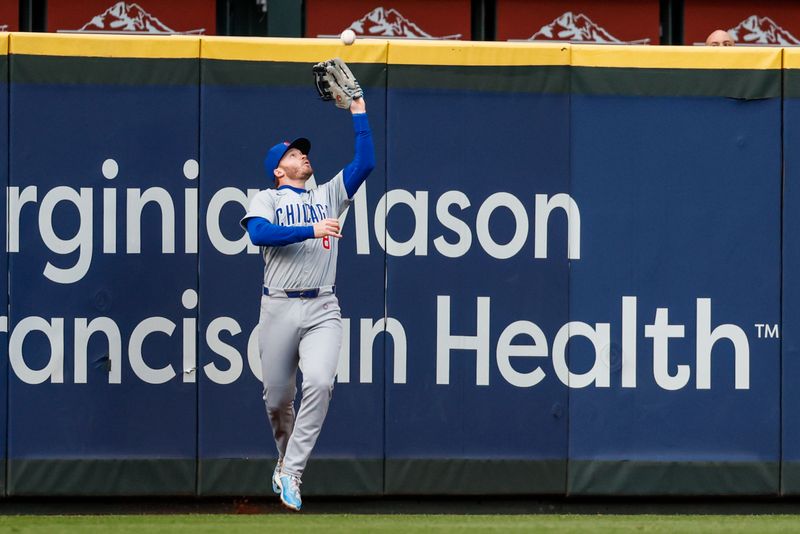 Apr 13, 2024; Seattle, Washington, USA; Chicago Cubs left fielder Ian Happ (8) catches a fly ball at the warning track against the Seattle Mariners during the second inning at T-Mobile Park. Mandatory Credit: Joe Nicholson-USA TODAY Sports