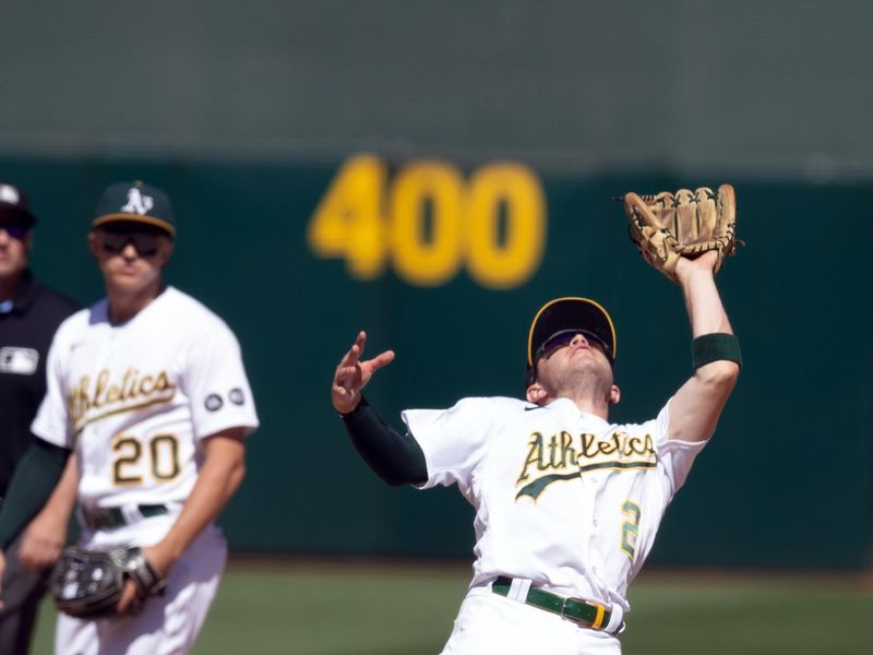 Sep 6, 2023; Oakland, California, USA; Oakland Athletics shortstop Nick Allen (2) makes the catch of a popup by Toronto Blue Jays center fielder Daulton Varsho during the ninth inning at Oakland-Alameda County Coliseum. Mandatory Credit: D. Ross Cameron-USA TODAY Sports