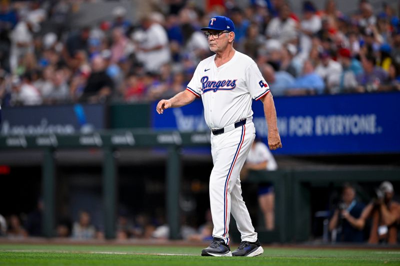 Aug 3, 2024; Arlington, Texas, USA;  Texas Rangers manager Bruce Bochy (15) walks to the pitchers mound during the fourth inning against the Boston Red Sox at Globe Life Field. Mandatory Credit: Jerome Miron-USA TODAY Sports