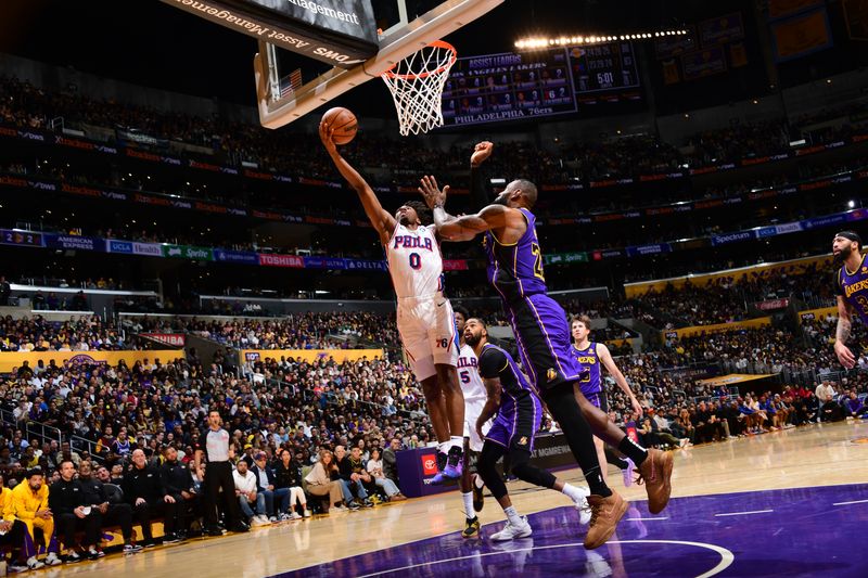 LOS ANGELES, CA - MARCH 22: Tyrese Maxey #0 of the Philadelphia 76ers drives to the basket during the game against the Los Angeles Lakers on March 22, 2024 at Crypto.Com Arena in Los Angeles, California. NOTE TO USER: User expressly acknowledges and agrees that, by downloading and/or using this Photograph, user is consenting to the terms and conditions of the Getty Images License Agreement. Mandatory Copyright Notice: Copyright 2024 NBAE (Photo by Adam Pantozzi/NBAE via Getty Images)