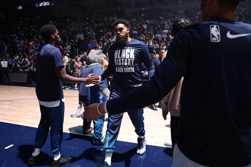 MINNEAPOLIS, MN -  FEBRUARY 4: Karl-Anthony Towns #32 of the Minnesota Timberwolves is introduced before the game against the Houston Rockets on February 4, 2024 at Target Center in Minneapolis, Minnesota. NOTE TO USER: User expressly acknowledges and agrees that, by downloading and or using this Photograph, user is consenting to the terms and conditions of the Getty Images License Agreement. Mandatory Copyright Notice: Copyright 2024 NBAE (Photo by David Sherman/NBAE via Getty Images)