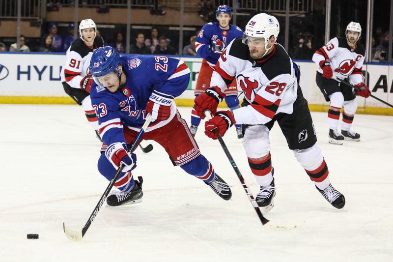 Mar 18, 2026; New York, New York, USA; New York Rangers defenseman Adam Fox (23) and New Jersey Devils right wing Timo Meier (28) battle for control of the puck in the third period at Madison Square Garden. Mandatory Credit: Wendell Cruz-Imagn Images Mar 18, 2026; New York, New York, USA; New York Rangers defenseman Adam Fox (23) and New Jersey Devils right wing Timo Meier (28) battle for control of the puck in the third period at Madison Square Garden. Mandatory Credit: Wendell Cruz-Imagn Images
